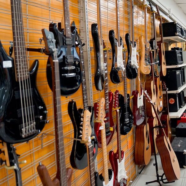 display wall of guitars