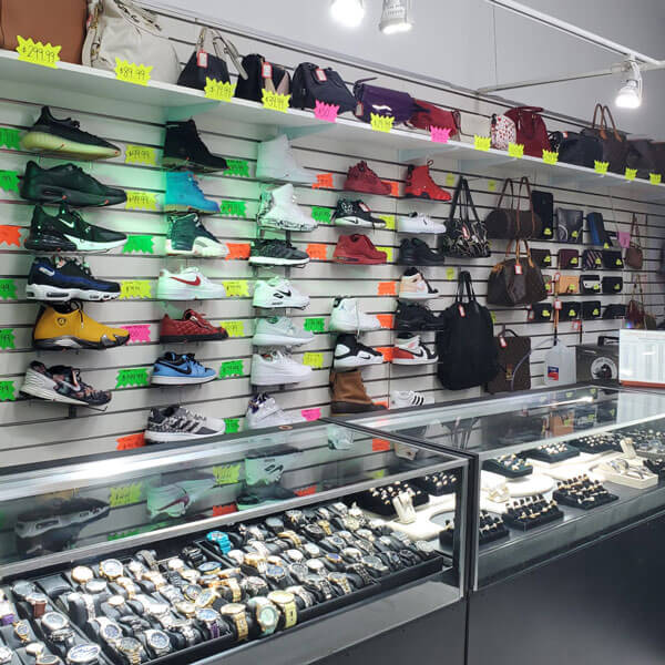 wall of shoes and display case of jewelry