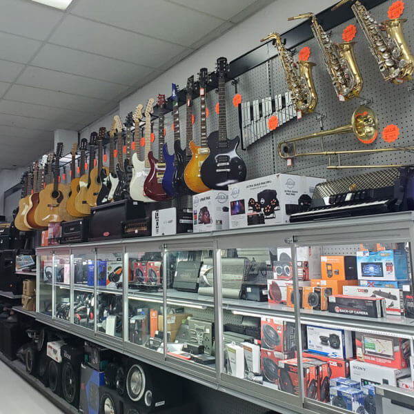 display case and wall of musical instruments